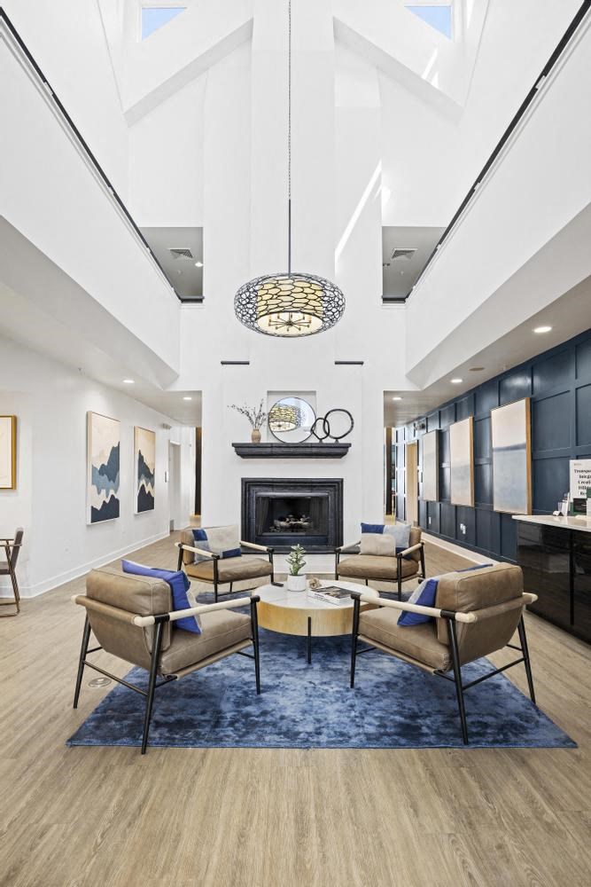 a living room filled with furniture and a fire place