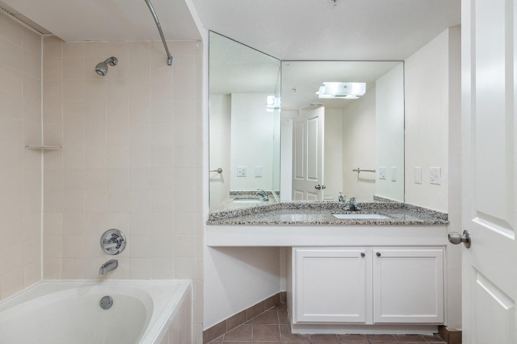 a bathroom with a bathtub and a sink