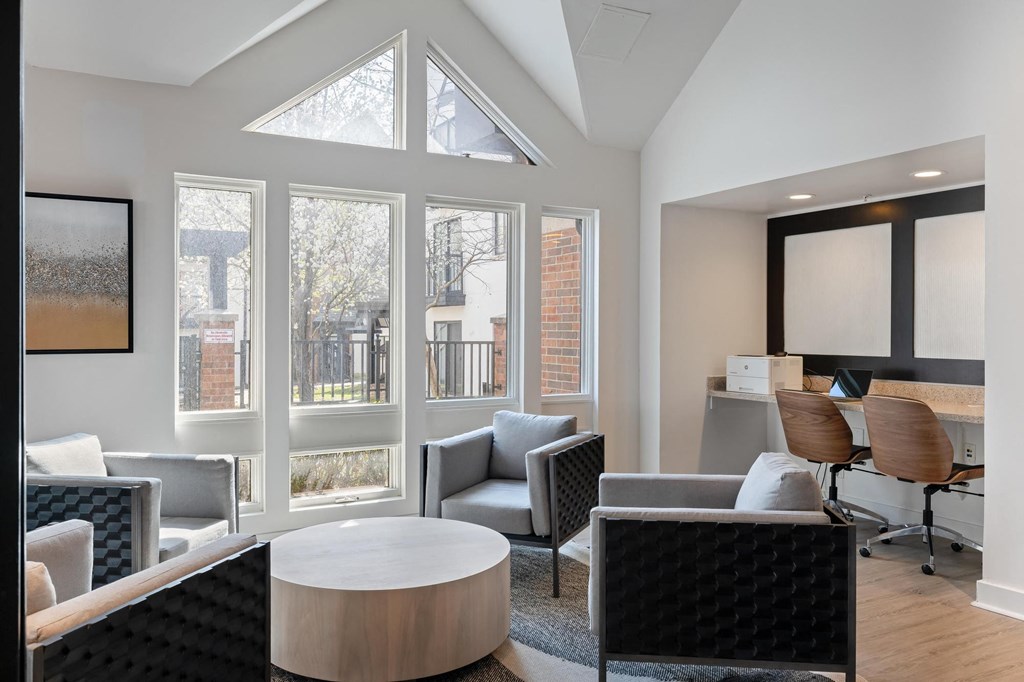 a living room with couches chairs and a table