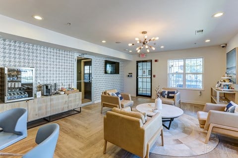 a living room with couches and chairs and a coffee table