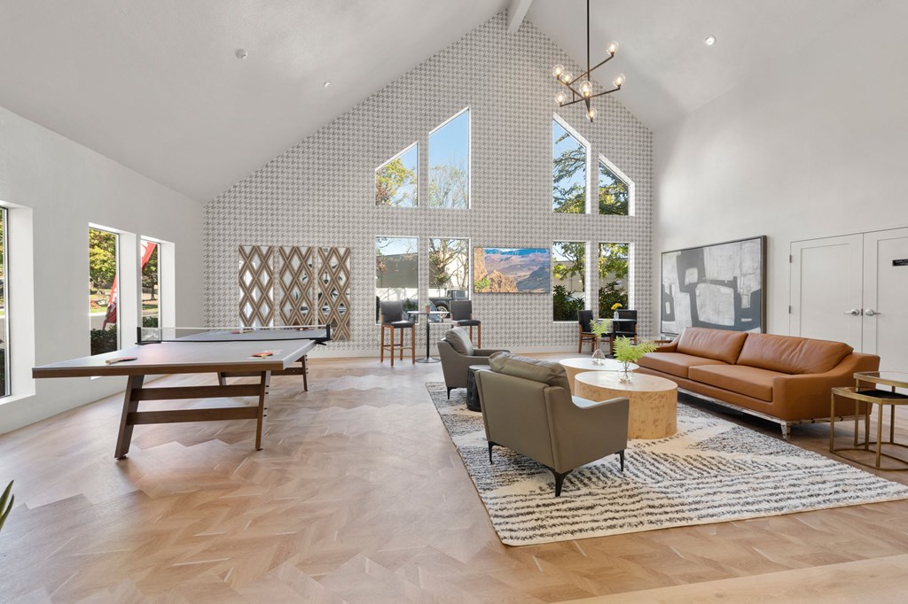 a living room with a couch table and a pool table at AVIA Lofts on Parkway Apartments, Vancouver, 98662