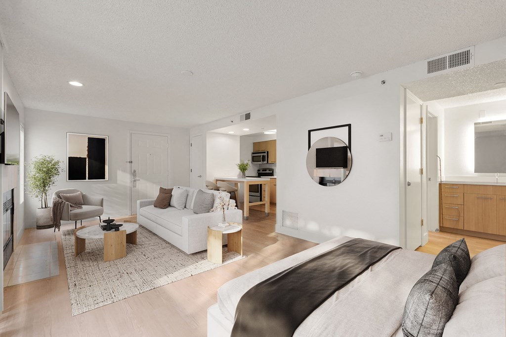 a living room with a couch and a bed at AVIA Lofts on Parkway Apartments, Washington, 98662