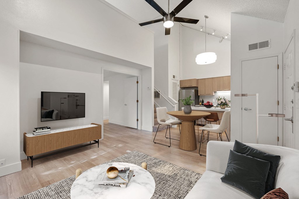 a living room with a couch and a table and a tv at AVIA Lofts on Parkway Apartments, Vancouver, WA, 98662