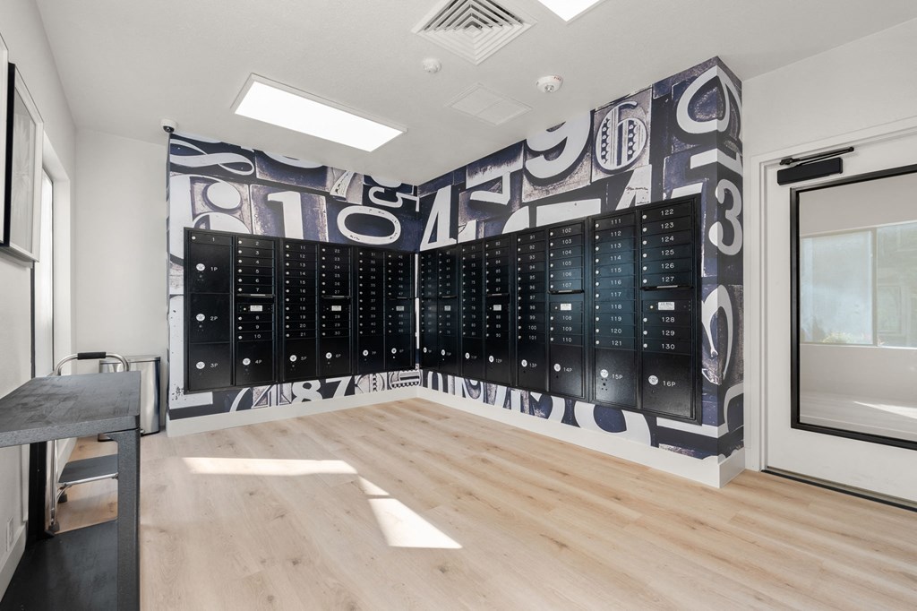 a large wall in a room with a filing cabinet and a desk at AVIA Lofts on Parkway Apartments, Washington