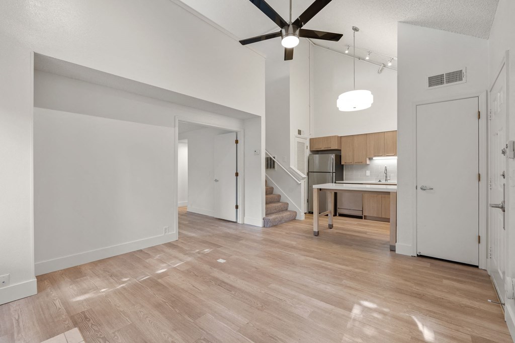 an open living room and kitchen with a ceiling fan at AVIA Lofts on Parkway Apartments, Vancouver, 98662