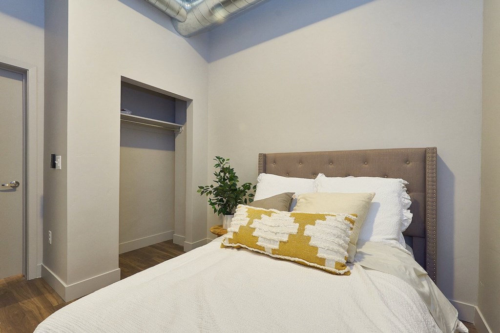 Bedroom with cozy bed at Brickside Heights Apartments, Millcreek, UT, 84106