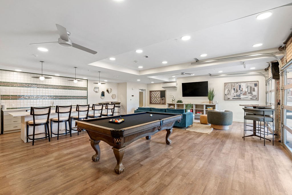 a game room with a pool table and a bar at The Revival, Salt Lake City