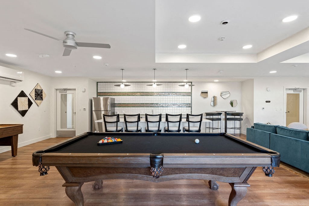 a game room with a pool table and a bar at The Revival, Utah, 84101