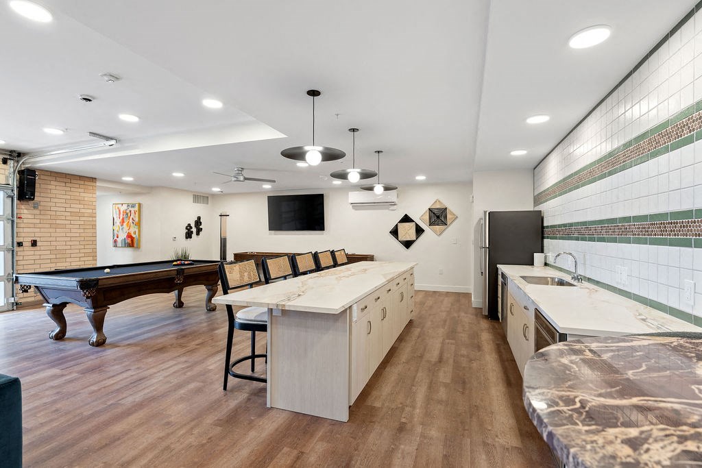 a game room with a pool table and a bar  at The Revival, Salt Lake City, UT 84101