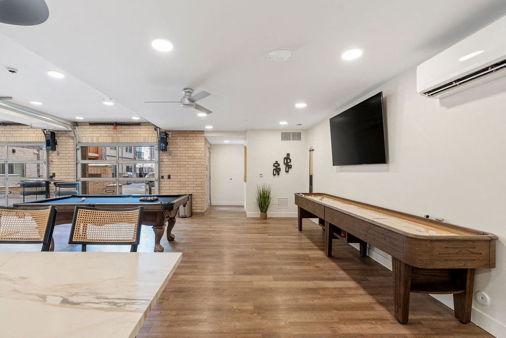 a game room with a pool table and a television at The Revival, Utah