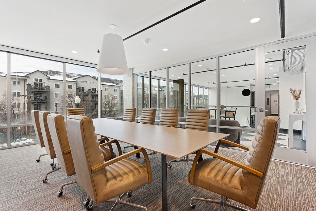 a conference room with a large table and chairs at The Revival, Salt Lake City Utah