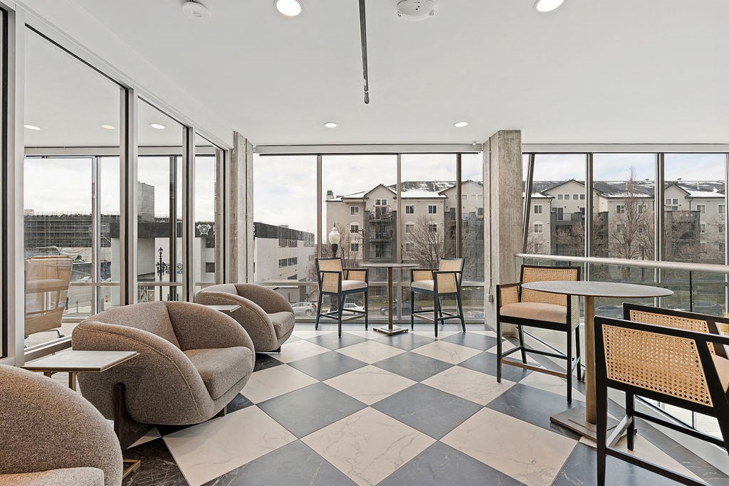 a lobby with chairs and tables and a checkered floor at The Revival, Salt Lake City, UT