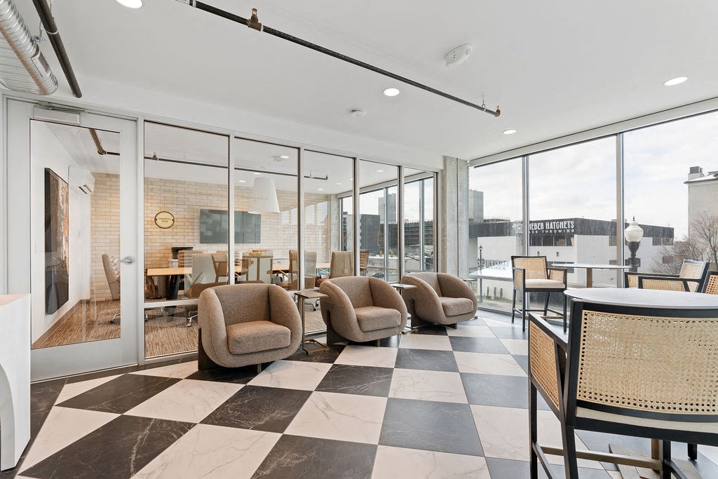 a lobby with a checkered floor and chairs and a table at The Revival, Utah, 84101