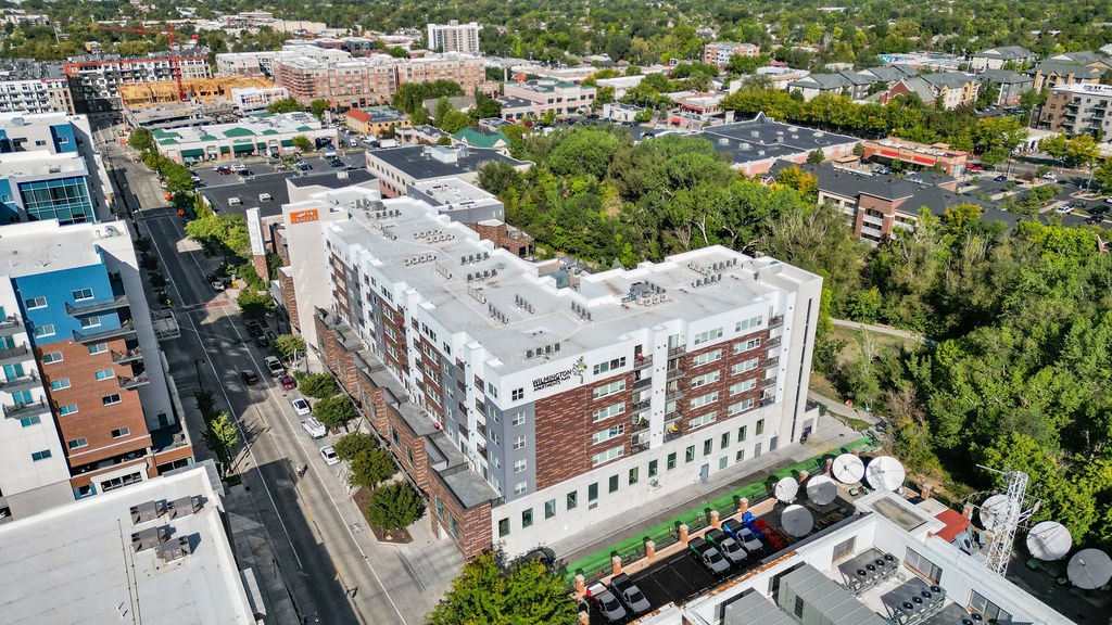 a view from above of a large white building with a red brick facade at Wilmington Flats Apartments, Utah, 84106