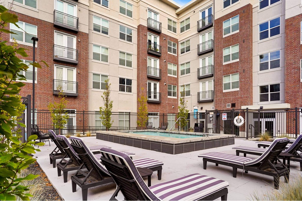 our apartments have an outdoor pool and lounge chairs at 200 City View, Provo, UT