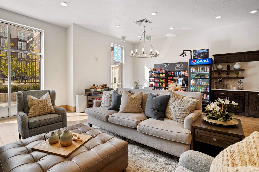 a living room with couches and chairs and a coffee table at 200 City View, Provo, UT