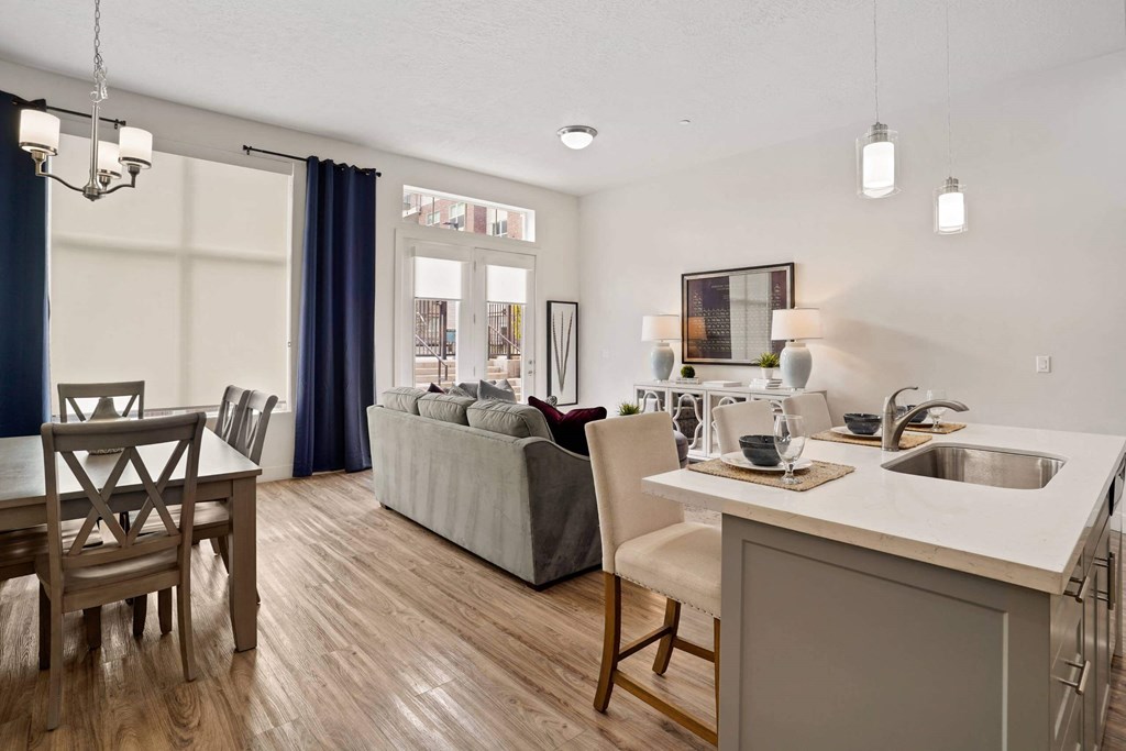 a living room and dining room with a couch and a table  at 200 City View, Utah, 84601