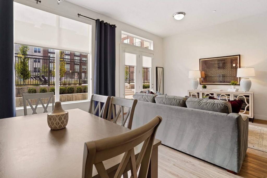 a living room with a couch and a table with chairs  at 200 City View, Utah