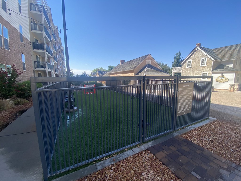 a fence with a pool in the backyard of a house