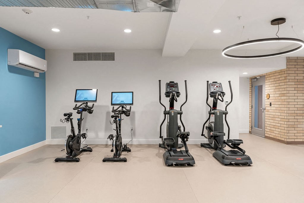 a group of exercise machines in a room at The Revival, Utah, 84101