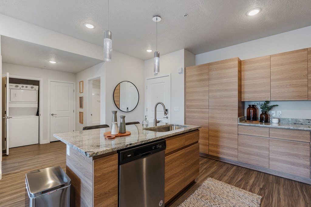 modern kitchen with stainless steel appliances at The Flats at Riverwoods, Provo