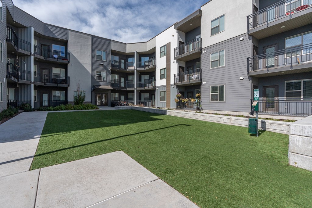 apartments patio and grass apartments patio and grass at The Flats at Riverwoods, Provo