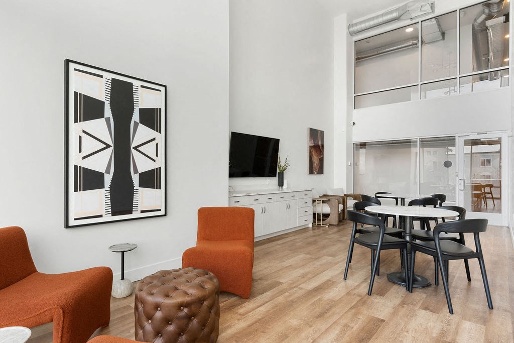 a living room and dining room with a table and chairs at The Revival, Salt Lake City, UT 84101