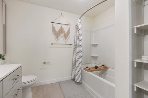 a bathroom with a shower and a toilet and a sink at Paperbox Lofts, Salt Lake City, UT