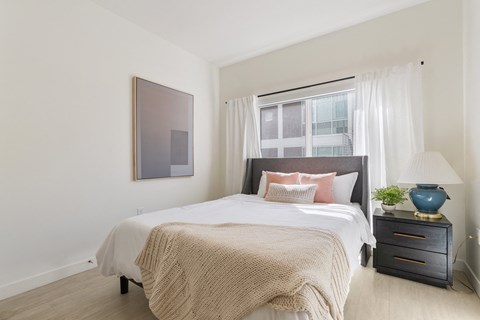 a bedroom with a large bed and a window at Paperbox Lofts, Salt Lake City, Utah