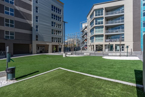 a lawn in front of a building with grass at Paperbox Lofts, Salt Lake City, Utah