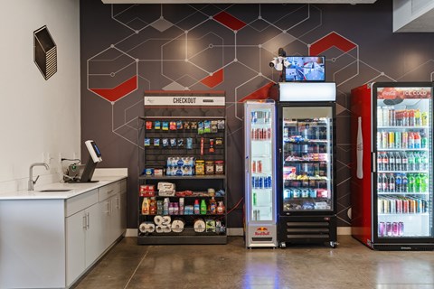 a convenience store with two refrigerators and a counter with sodas and other drinks at Paperbox Lofts, Salt Lake City, Utah