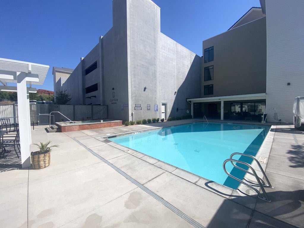 the pool area of a building with a swimming pool