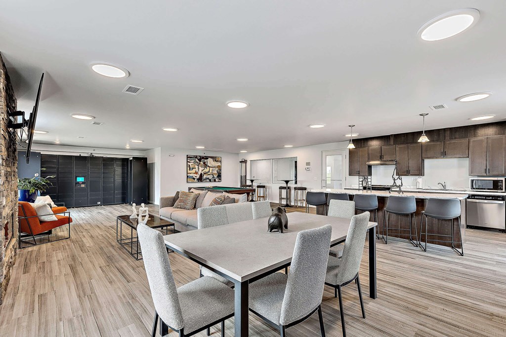 a living room and kitchen area with a dining table and chairs at Red Rock Apartments, South Dakota 57702