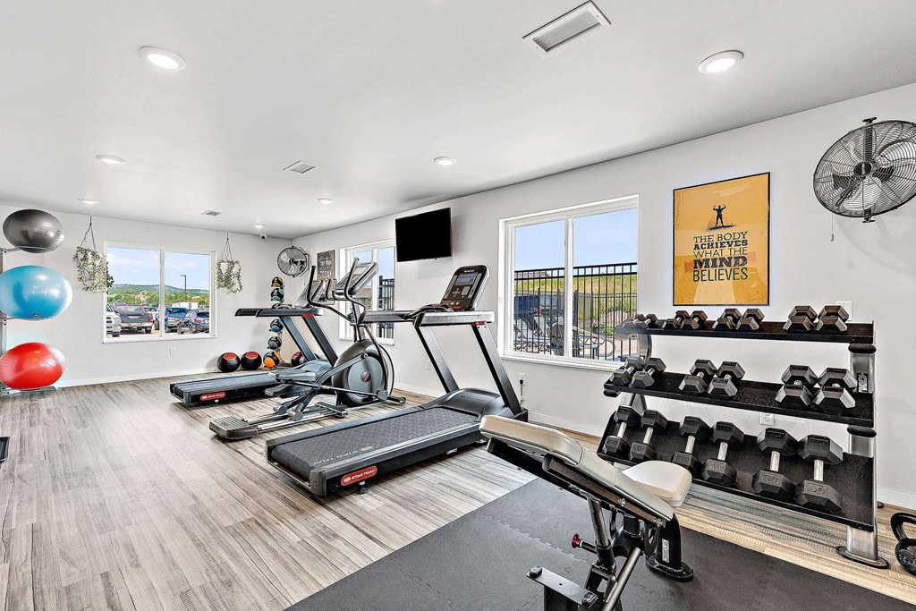 a workout room with treadmills and other exercise equipment at Red Rock Apartments, South Dakota 57702