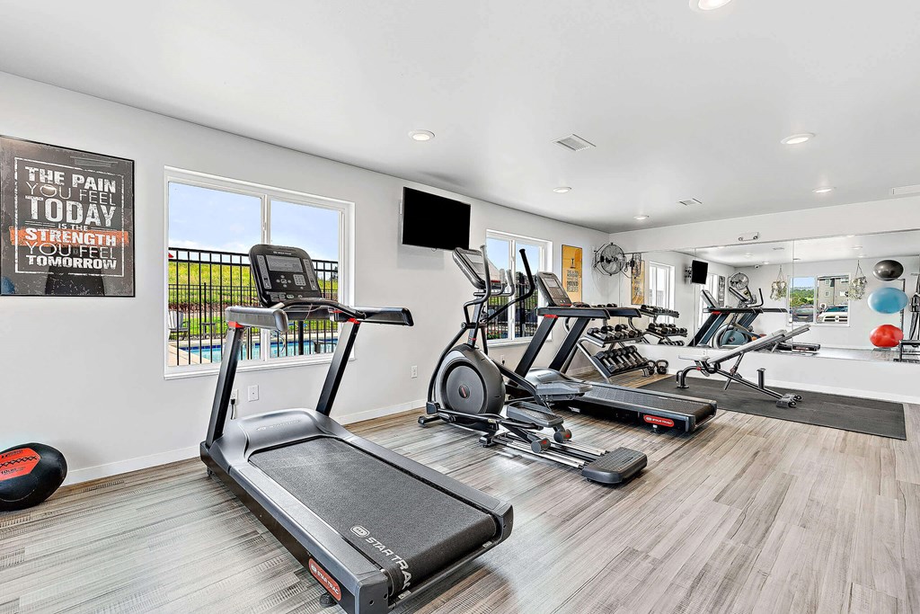a workout room with treadmills and other exercise equipment at Red Rock Apartments, Rapid City, SD, 57702