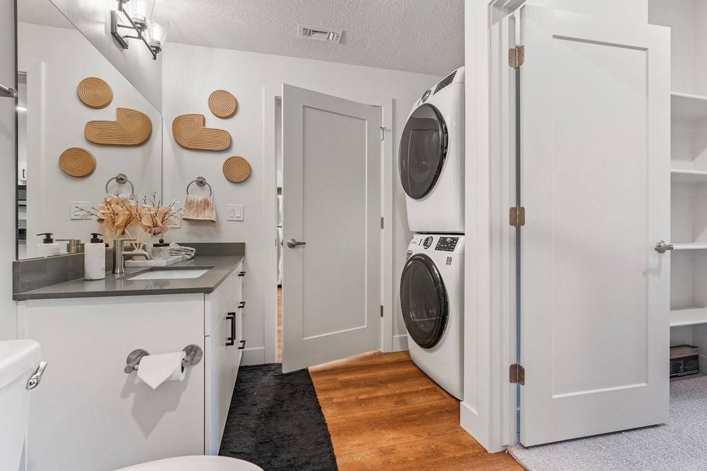 a small laundry room with a washer and dryer and a sink at The Revival, Utah, 84101