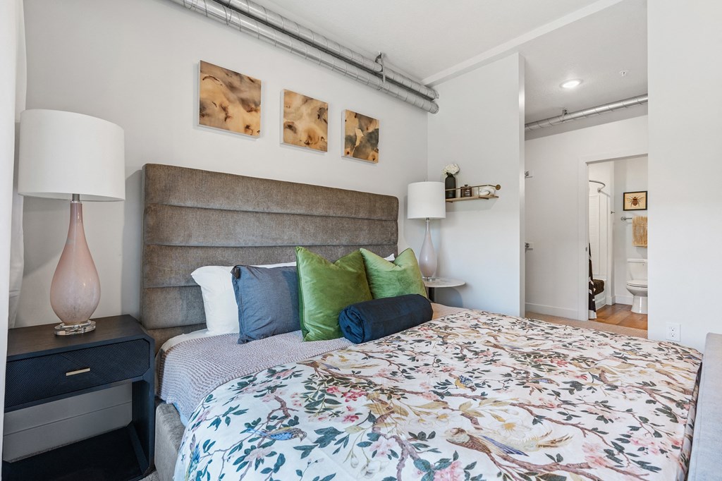 a bedroom with a large bed and pillows at The Revival, Salt Lake City, Utah