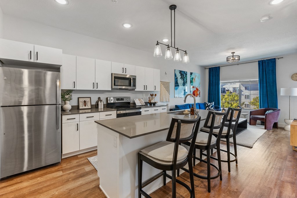 an open kitchen with a large island with bar stools at The Revival, Salt Lake City, Utah