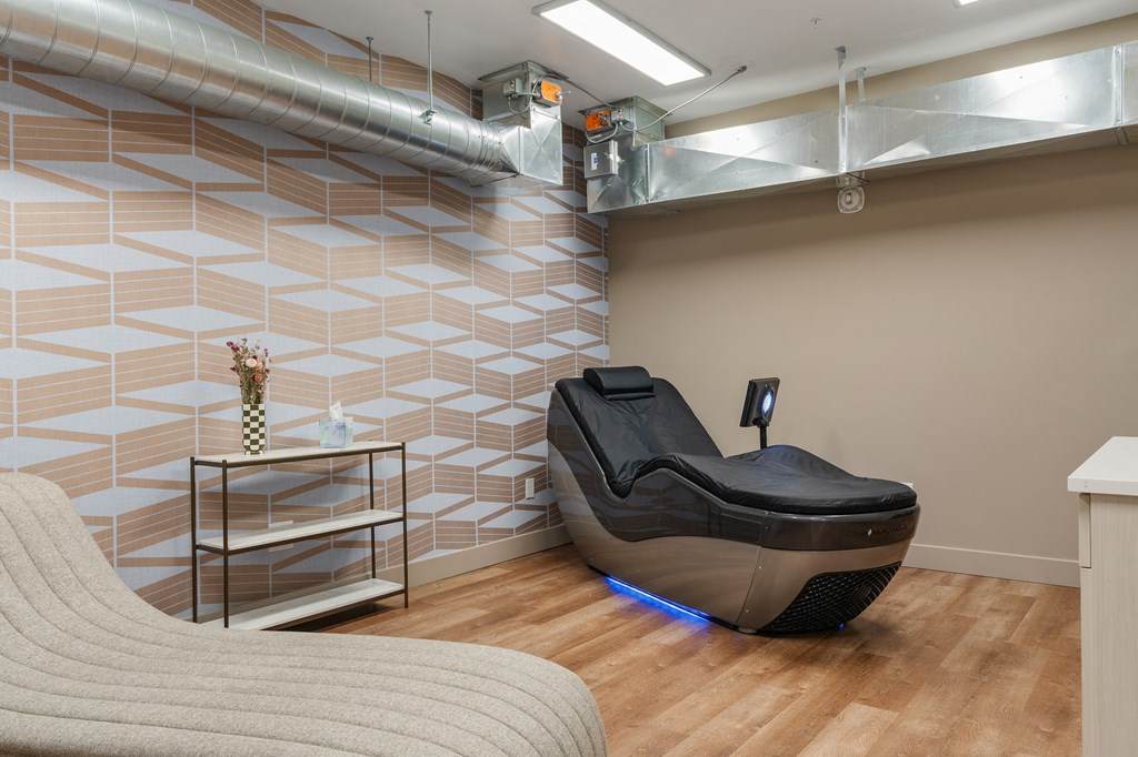 a spa room with a massage chair and a couch at The Revival, Salt Lake City, Utah