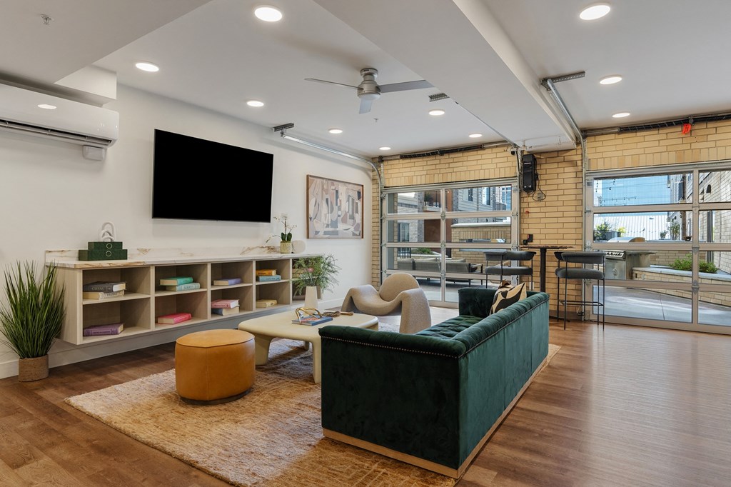 a living room with a couch and a tv at The Revival, Salt Lake City, Utah