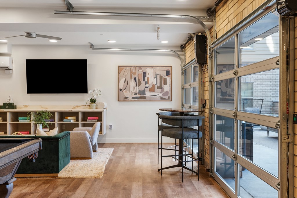 a living room with a bar and a flat screen tv at The Revival, Salt Lake City, 84101