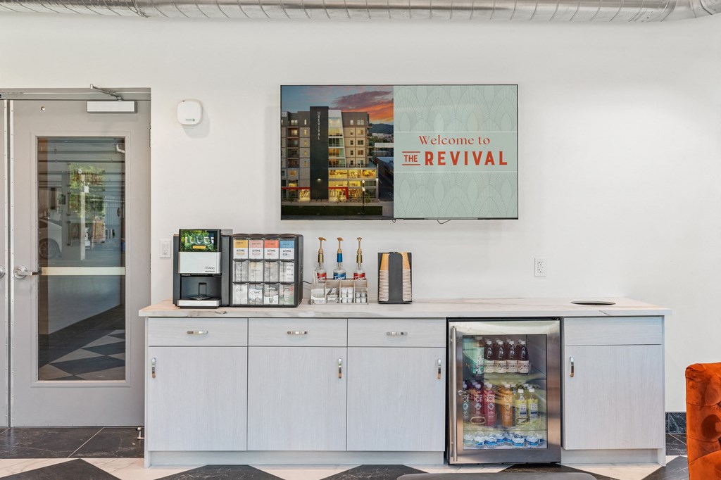 a counter with a vending machine and a sign that reads welcome to the revival at The Revival, Salt Lake City