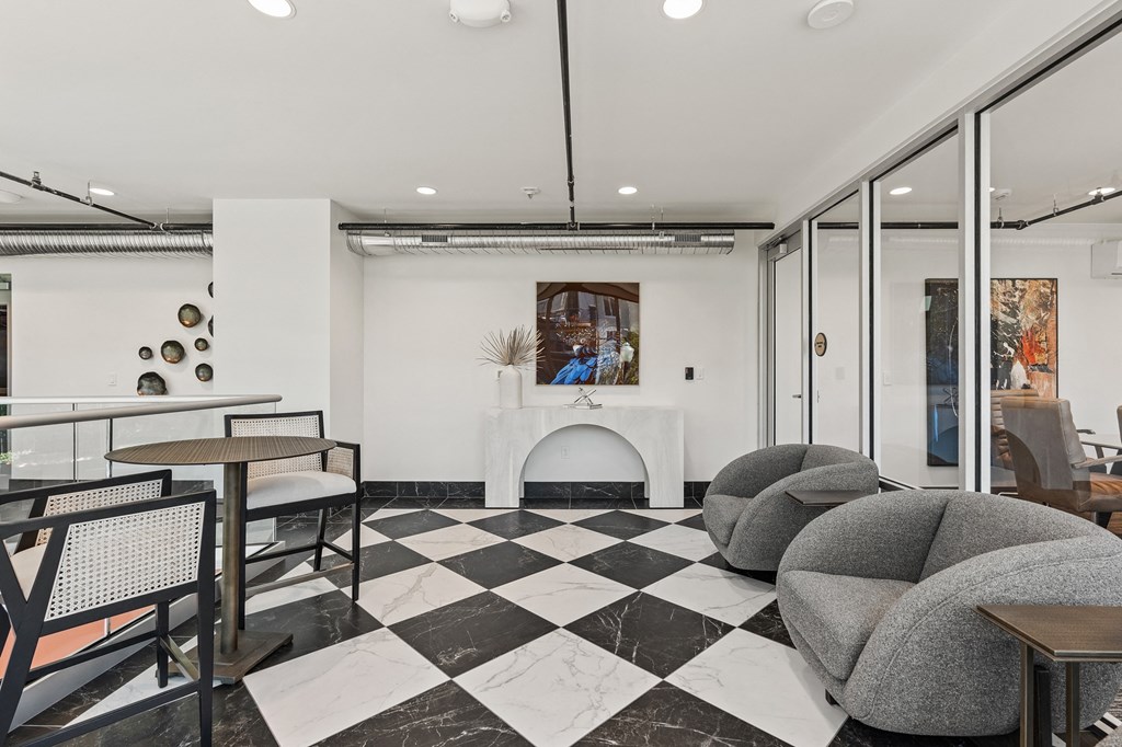 a living room with couches and tables and a fireplace at The Revival, Salt Lake City, UT