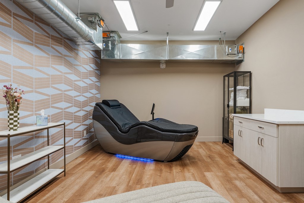 a spa room with a massage chair and a sink at The Revival, Salt Lake City, UT, 84101