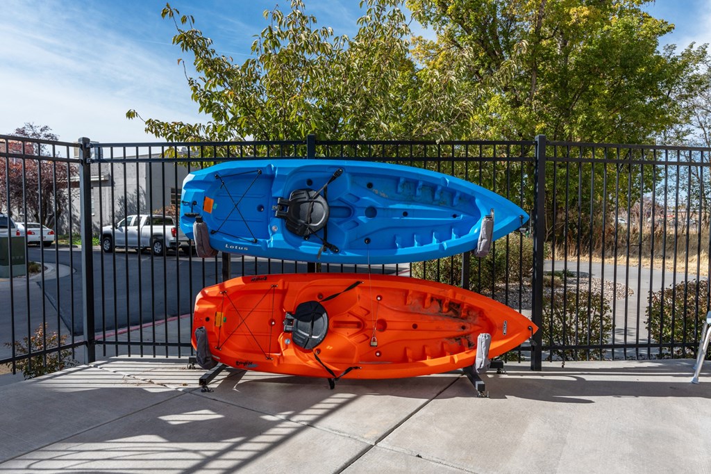 two kayaks on a rack in front of a fenceat The View on 20th, Utah