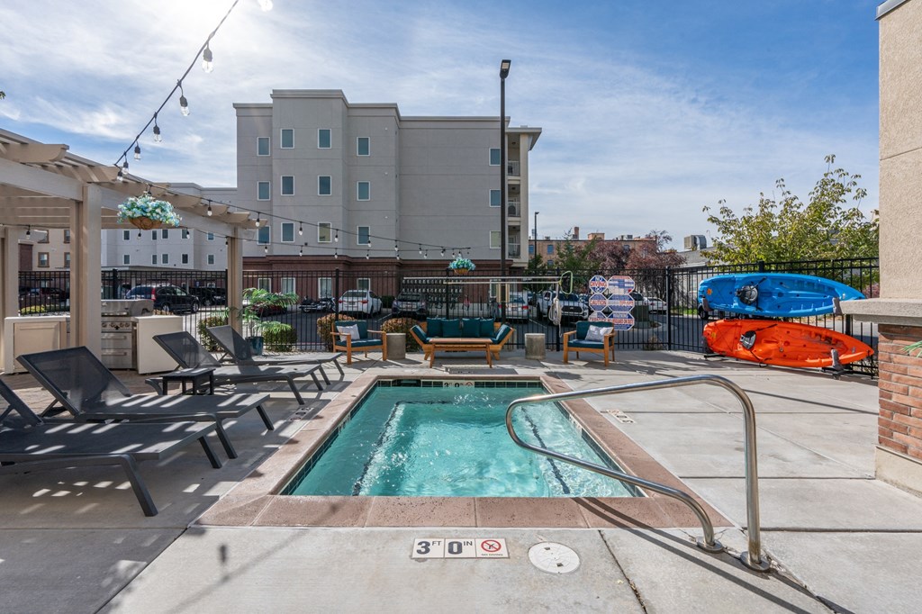 our apartments have a swimming pool and a patio with lounge chairsat The View on 20th, Ogden, UT, 84401