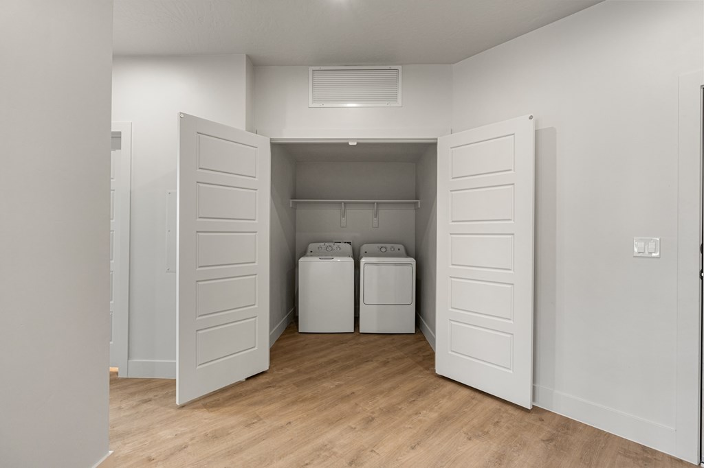 A laundry room with a washer and dryer. at The Vue At Desert Color, St. George, UT
