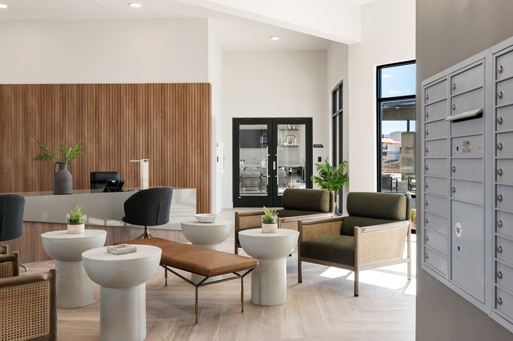 A modern living room with a wooden panelled wall and a variety of seating options. at The Vue At Desert Color, Utah, 84790