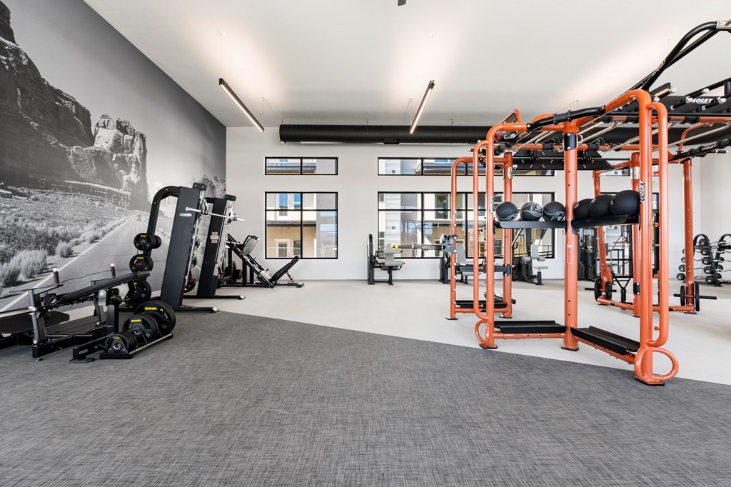 A gym with orange and black equipment. at The Vue At Desert Color, Utah, 84790