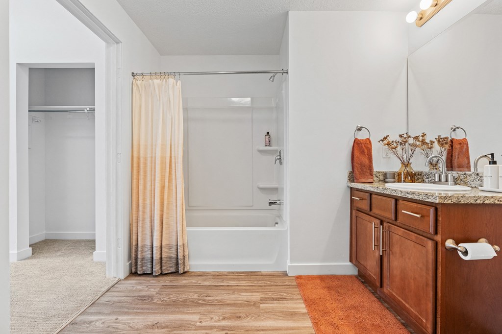 a bathroom with a shower and a sink and a mirrorat The View on 20th, Ogden, Utah